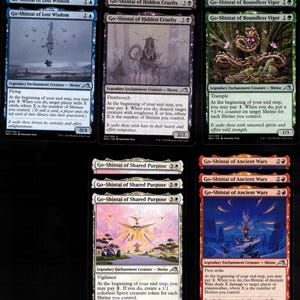 May include: A collection of Magic: The Gathering trading cards featuring Go-Shintai of Lost Wisdom, Hidden Cruelty, Boundless Vigor, Shared Purpose, and Ancient Wars. Each card displays unique artwork, text, and stats for these legendary shrine creatures.