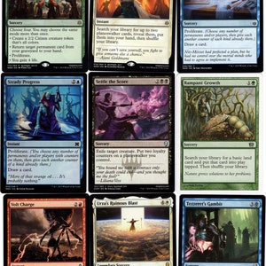 May include: A set of ten Magic: The Gathering cards featuring various illustrations and text. The cards are arranged in a grid of two rows and five columns. The cards are all different colors and have different illustrations. The text on the cards is in English.