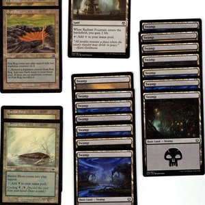 May include: A collection of Magic: The Gathering cards, including Peat Bog, Barren Moor, Radiant Fountain, and Swamp. The cards are arranged in rows and columns, with the names of the cards visible.