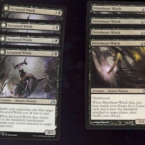 May include: A collection of black and white Magic: The Gathering trading cards. The cards feature illustrations of witches and include text describing their abilities. The cards are titled "Accursed Witch" and "Bitterheart Witch".