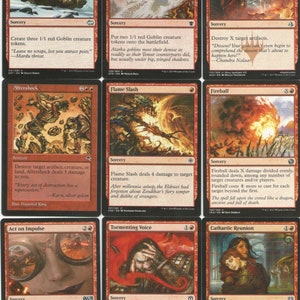 May include: A set of ten Magic: The Gathering cards featuring red and black designs. The cards depict various scenes of fire, goblins, and other fantasy creatures. The cards are from the sets Dragons of Tarkir, Oath of the Gatewatch, and Kaladesh.