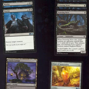 May include: A collection of Magic: The Gathering trading cards. The cards feature various illustrations and text, including the cards "Murder", "Festering Newt", "Witch's Cottage", and "Elixir of Immortality". The cards are in English.