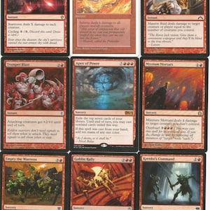 May include: A collection of 10 Magic: The Gathering cards featuring red and orange colors with illustrations of fire, goblins, and warriors. The cards are from the set "M19" and feature various abilities and effects.