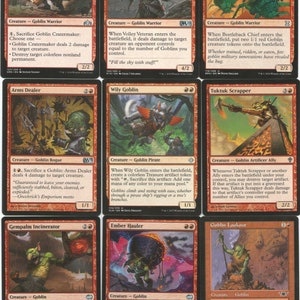 May include: A set of nine trading cards featuring goblins from the Magic: The Gathering card game. The cards are red and black with illustrations of goblins in various poses. The cards are all from the same set, and they feature different abilities and stats.