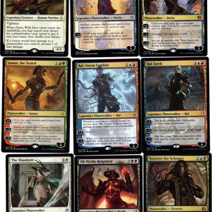 May include: A set of ten Magic: The Gathering cards featuring various planeswalkers, including Djeru, Dovin, Samut, Ral, The Wanderer, Ob Nixilis, and Tezzeret. The cards are in a variety of colors, including red, blue, green, black, and white.