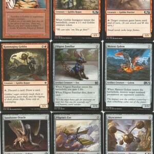 May include: A set of ten trading cards featuring fantasy creatures and characters. The cards are in various colors, including red, black, and white. Each card has a name, a description, and an illustration. The cards are from the Magic: The Gathering trading card game.