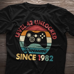 42nd birthday shirt. Level 42 Unlocked. 42nd birthday gift. 1982 Birthday Party Gaming T-Shirt. Gamer Gift For Men Gift for Women Gift Idea