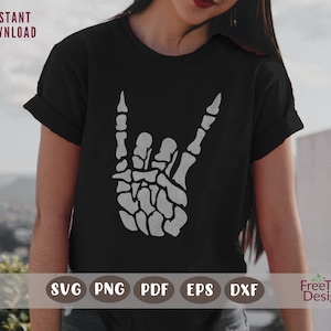 May include: A black t-shirt with a white skeleton hand making the rock and roll hand gesture. The text "SVG PNG PDF EPS DXF" is printed below the image. The text "FreeTree Designs" is printed in the bottom right corner.