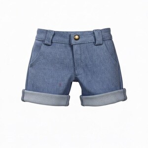 May include: Light blue denim shorts with a rolled hem. The shorts have a button closure and belt loops. The pockets are visible on the front. A classic style for casual wear.