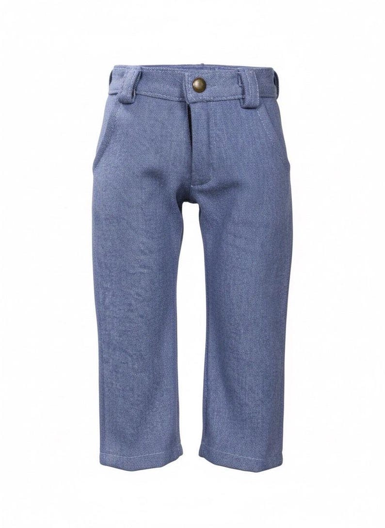 May include: Blue denim-style pants with a button closure and belt loops. The pants have two front pockets and a straight leg design. The fabric has a subtle textured appearance. The pants are designed for children.