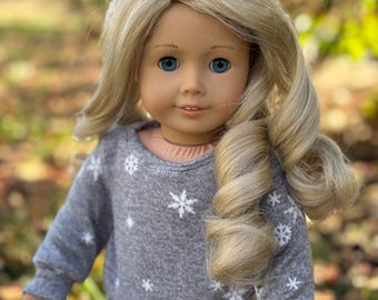 Two piece set includes gray, snowflake sweatshirt and white leggings made to fit popular 18 inch dolls