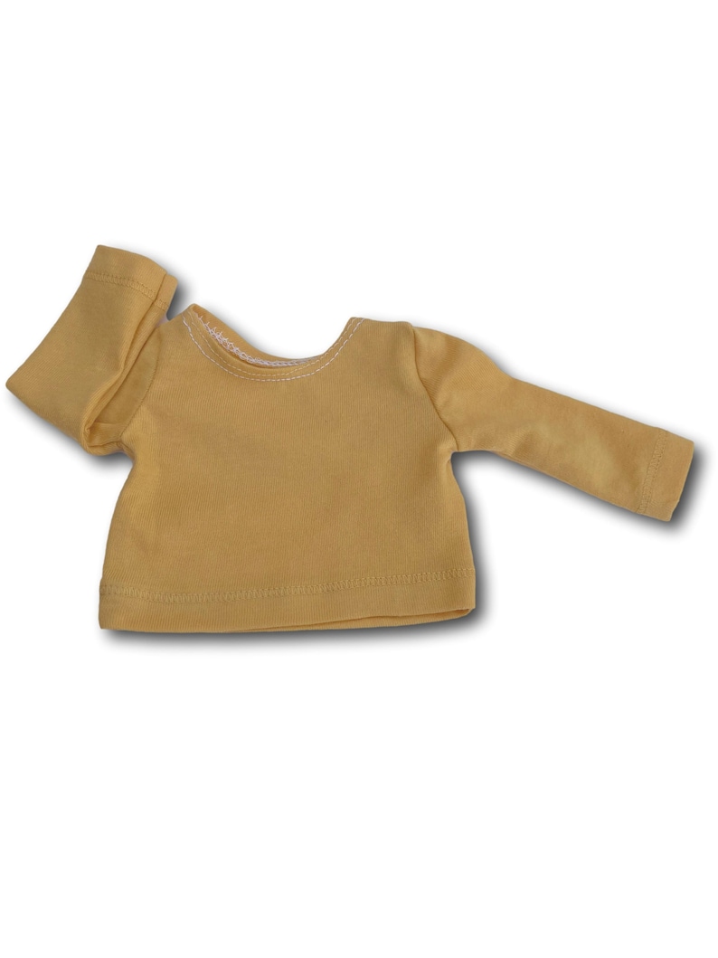 K&ouml;nnte beinhalten: Ein gelbes Langarmshirt mit Rundhalsausschnitt.