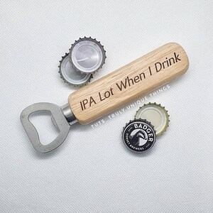 May include: Wooden bottle opener with a metal cap opener and a handle that says "IPA Lot When I Drink" and "TUTS TRULY UNIQUE THINGS".