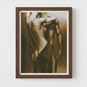 May include: Framed sepia-toned artwork depicting the backs of two figures. One figure is partially undressing the other. The artwork is in a brown wooden frame and is displayed against a white wall.