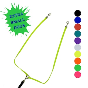 May include: A neon yellow dog leash with two leads, each ending in a silver-colored metal clip. The leash is connected to a black handle. A green burst graphic with the text "EXTRA SMALL DOGS" is in the upper left corner. A color chart is on the right.