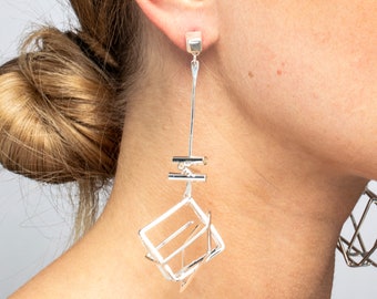 Silver earrings dangling for women