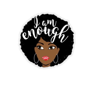 May include: A sticker with a black and white illustration of a woman with an afro hairstyle. The text "I am enough" is written in white cursive letters on the sticker.