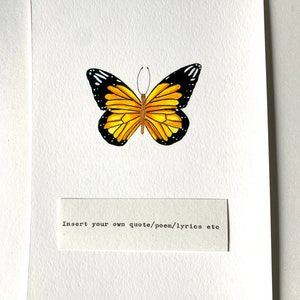 May include: A white card with a yellow and black butterfly illustration. The card has the text "Insert your own quote/poem/lyrics etc" printed on it.