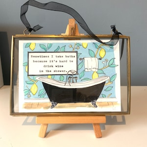 Framed bathroom print with vintage typed quote