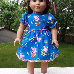 Made for 18 Inch Size Dolls, Blue Peppa Pig Dress with Lace Trim.