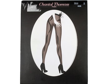 May include: A black and white illustration of a woman wearing black tights with a black and white pattern. The illustration is on a white background and is surrounded by a black oval. The text "Chantal Thomass Paris" and "Taille 2 Noir" is visible at the top of the image.