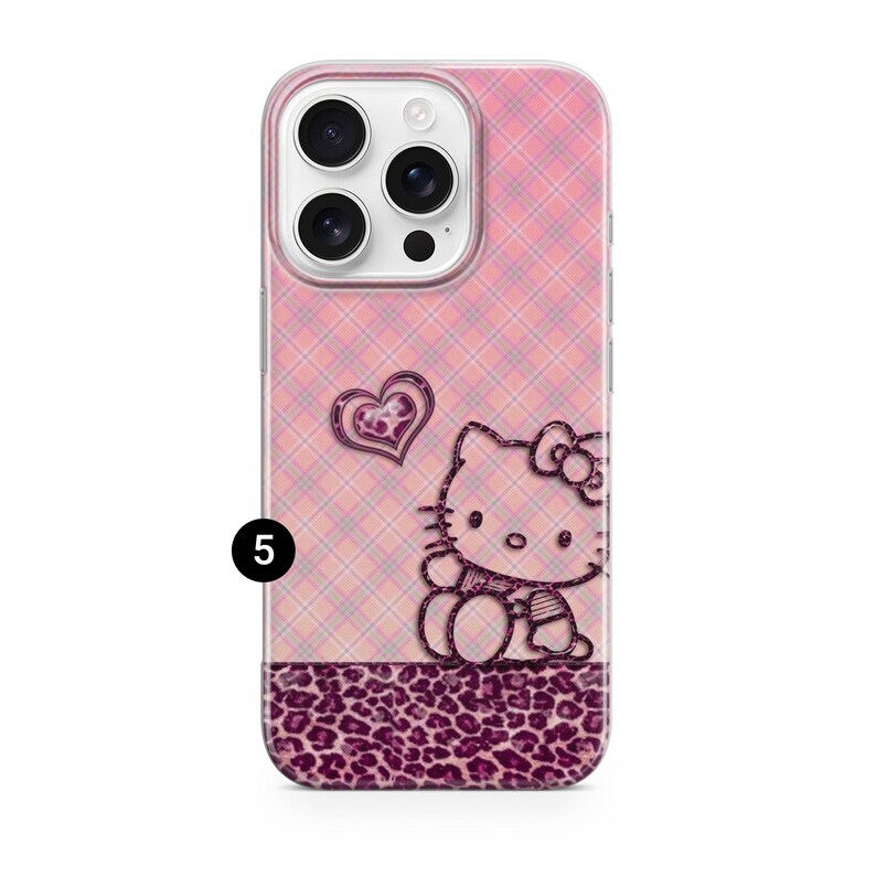 May include: Pink phone case with a plaid pattern and a Hello Kitty design. The case features a heart and a leopard print border. The phone case is designed for a smartphone.