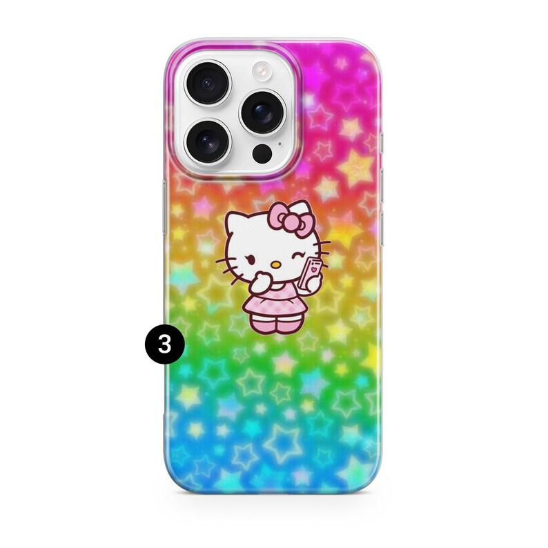 May include: A colorful phone case featuring a cartoon image of Hello Kitty taking a selfie. The case has a rainbow star pattern background. The phone case is designed to fit a smartphone.