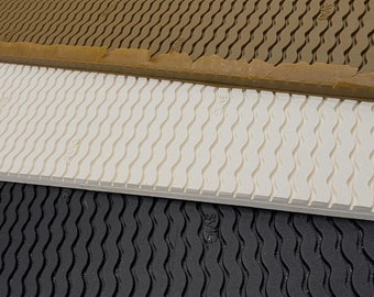 May include: Three sheets of textured rubber material in different colors: brown, white, and black. Each sheet has a wavy pattern and the word "SIVIC" printed on it.