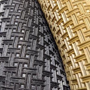 May include: Close-up of two bicycle tyres with different tread patterns. The tyre on the left has a black, diamond-shaped tread pattern. The tyre on the right has a brown, diamond-shaped tread pattern.
