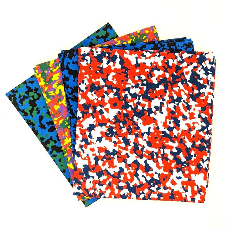 May include: A set of five sheets of camouflage patterned foam. The sheets are in various colors, including red, blue, green, yellow, and white.