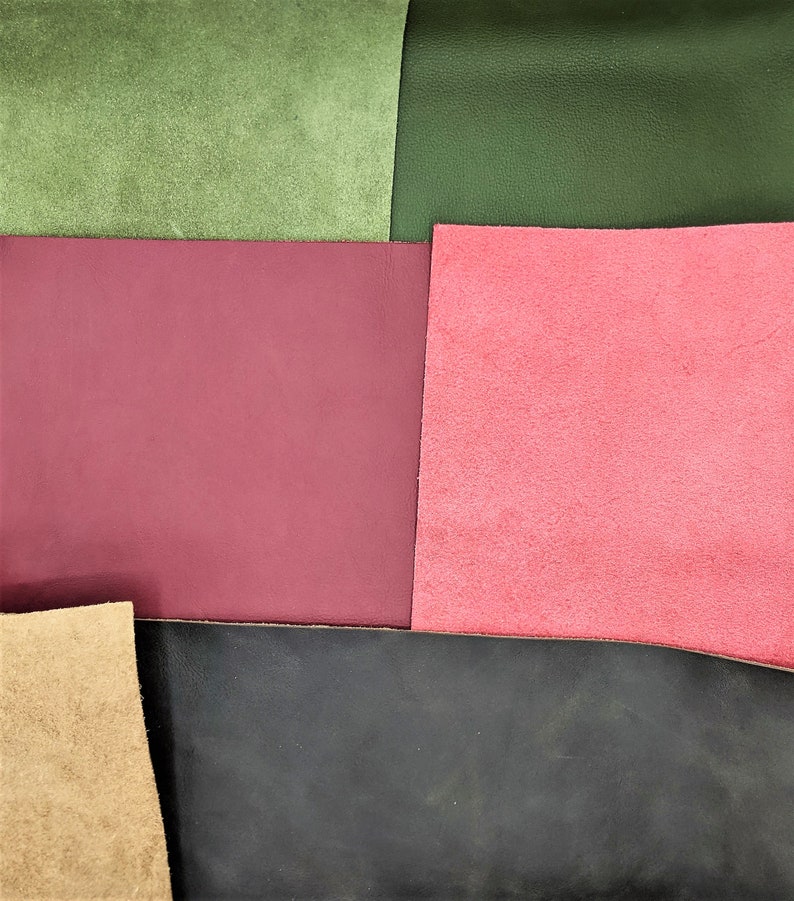 May include: A close-up of five different colored leather swatches. The swatches are arranged in a grid pattern. The colors are green, burgundy, pink, black, and tan.