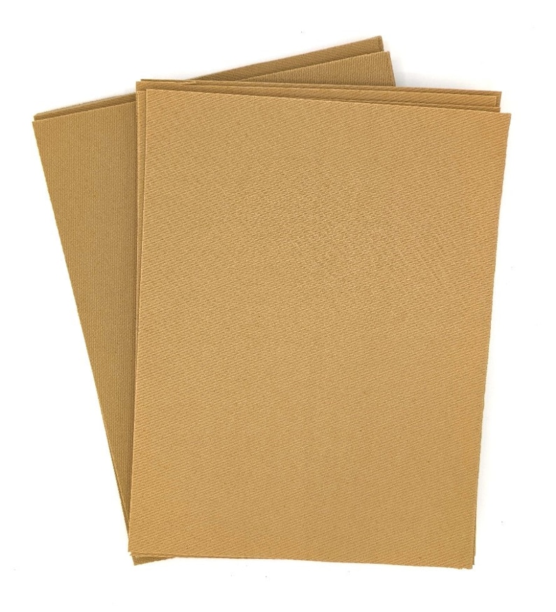 May include: A stack of three brown cardstock sheets. The sheets have a subtle textured surface.