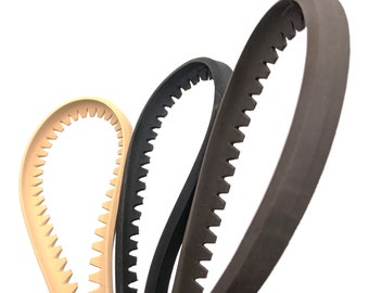 May include: Three rubber timing belts with teeth. The belts are brown, black, and beige.