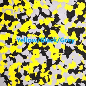 May include: Abstract pattern fabric with yellow, black, and gray colors. The fabric has a camouflage design.