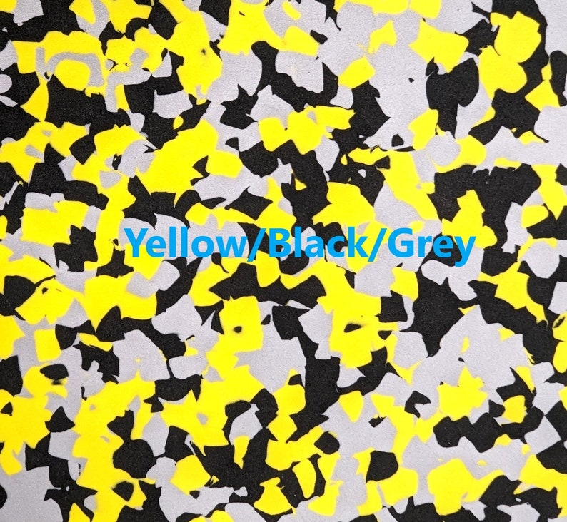 May include: Abstract pattern fabric with yellow, black, and gray colors. The fabric has a camouflage design.
