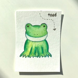 Süße grüne Frosch Kröte, Kinder Illustration Stil Karte Malerei, Mini Aquarell niedlich lächelnd wunderliche Kröte Karte