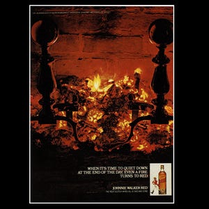May include: Vintage advertisement featuring a fireplace with a burning fire. The image includes a bottle of Johnnie Walker Red Scotch and the text: "When it's time to quiet down at the end of the day, even a fire turns to red."