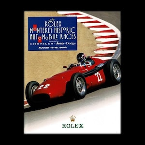 May include: A vintage red race car with the number 22 speeds around a track in an advertisement for the Rolex Monterey Historic Automobile Races. The poster includes the event details and the Rolex logo.