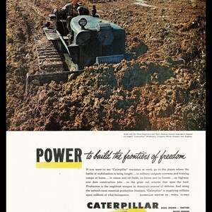 May include: Vintage advertisement featuring a Caterpillar bulldozer in a muddy field. The machine is olive green with a driver wearing a helmet. The ad includes the text "POWER to build the frontiers of freedom" and "CATERPILLAR".