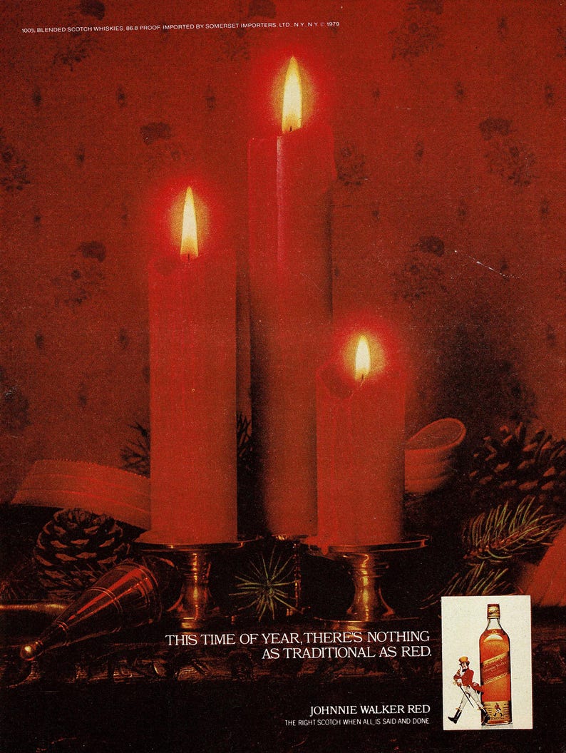 May include: An advert showing three lit red candles on a decorative stand. The text reads "THIS TIME OF YEAR, THERE'S NOTHING AS TRADITIONAL AS RED." A bottle of Johnnie Walker Red is also shown.