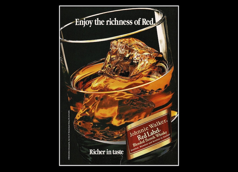 May include: A glass of amber-colored liquid with large ice cubes, the drink is labeled "Johnnie Walker Red Label Blended Scotch Whisky." The text "Enjoy the richness of Red" and "Richer in taste" are also visible.