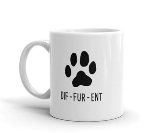 May include: White ceramic coffee mug with a black paw print and the text "DIF-FUR-ENT" in black.
