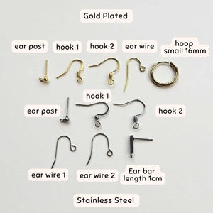 May include: Assortment of gold plated and stainless steel earring findings, including ear posts, hooks, ear wires, and a small hoop. The hoop is 16mm in diameter.