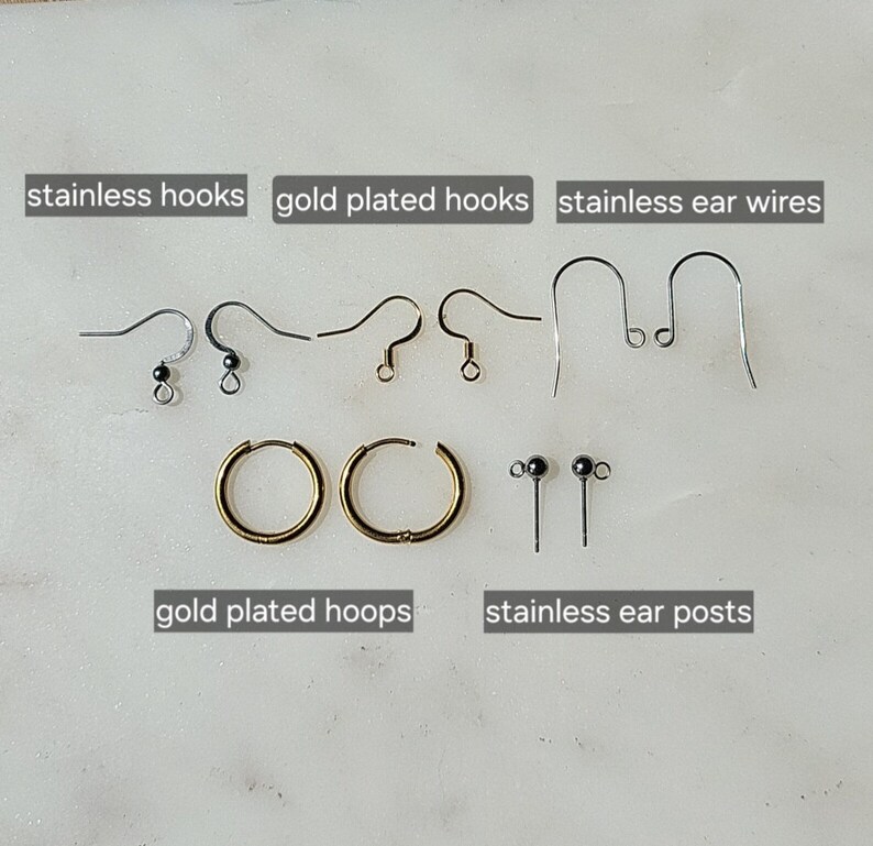 May include: Assortment of earring findings including stainless steel hooks, gold plated hooks, stainless steel ear wires, gold plated hoops, and stainless steel ear posts.