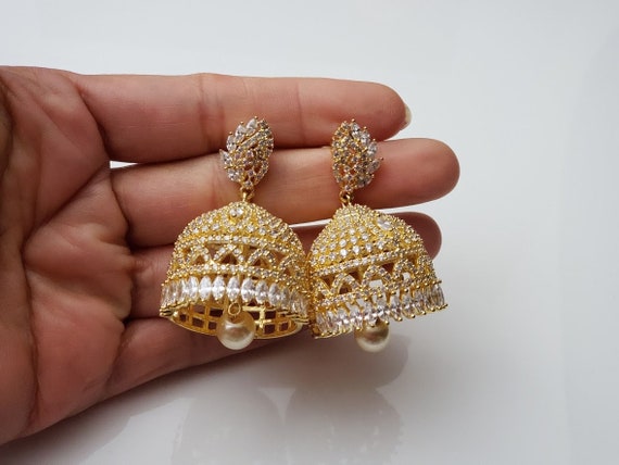 Gold Plated CZ Lakshmi Devi Designer Jhumka Earrings with Pearls – Estele