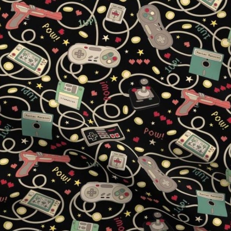 May include: A black background with a repeating pattern of retro video game controllers, game cartridges, and pixelated hearts. The pattern also includes the words "Pow!" and "1Up!" in a pixelated font.