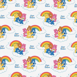 May include: A repeating pattern featuring Care Bears, rainbows, and clouds on a white background. The bears are in various colors, including yellow, blue, pink, and brown. The text "Care Bears" is also present.