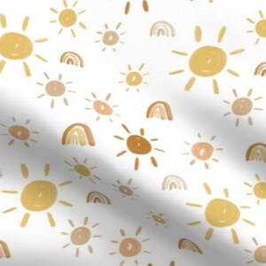 May include: A seamless pattern featuring a white background with a repeating design of yellow and brown suns and rainbows.