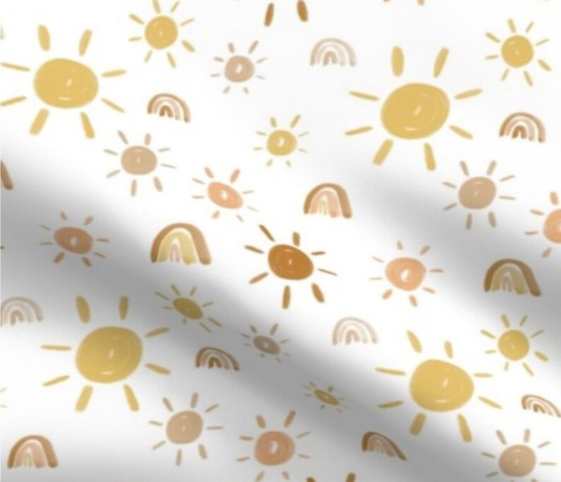 May include: A seamless pattern featuring a white background with a repeating design of yellow and brown suns and rainbows.