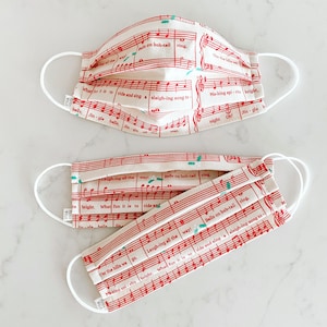 Jingle Bells Face Mask / 100% cotton / 3 Layers / Pellon Interfacing / Reusable / Elastic straps / Made in USA